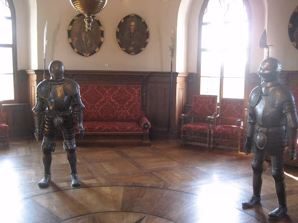Armored knights display in Trakošćan Castle interior, a highlight of the Trakošćan & Varaždin day tour