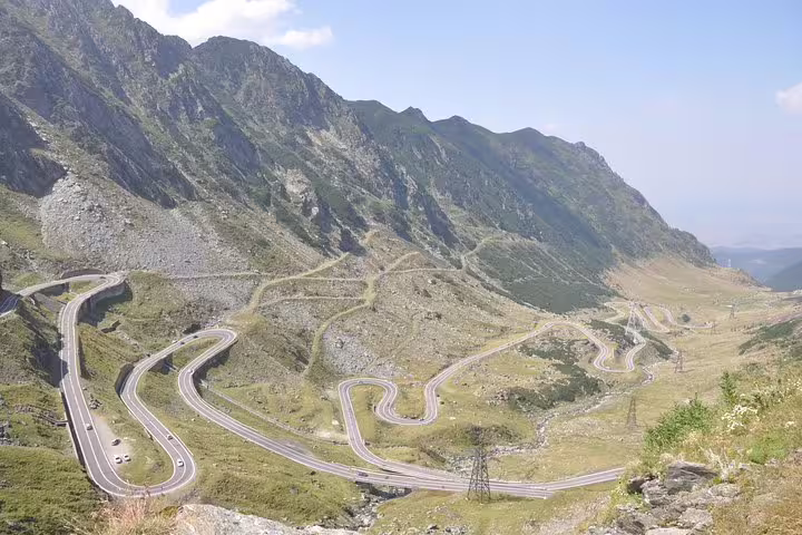 Aerial view of Transfagarasan Road winding through Fagaras Mountains in Romania