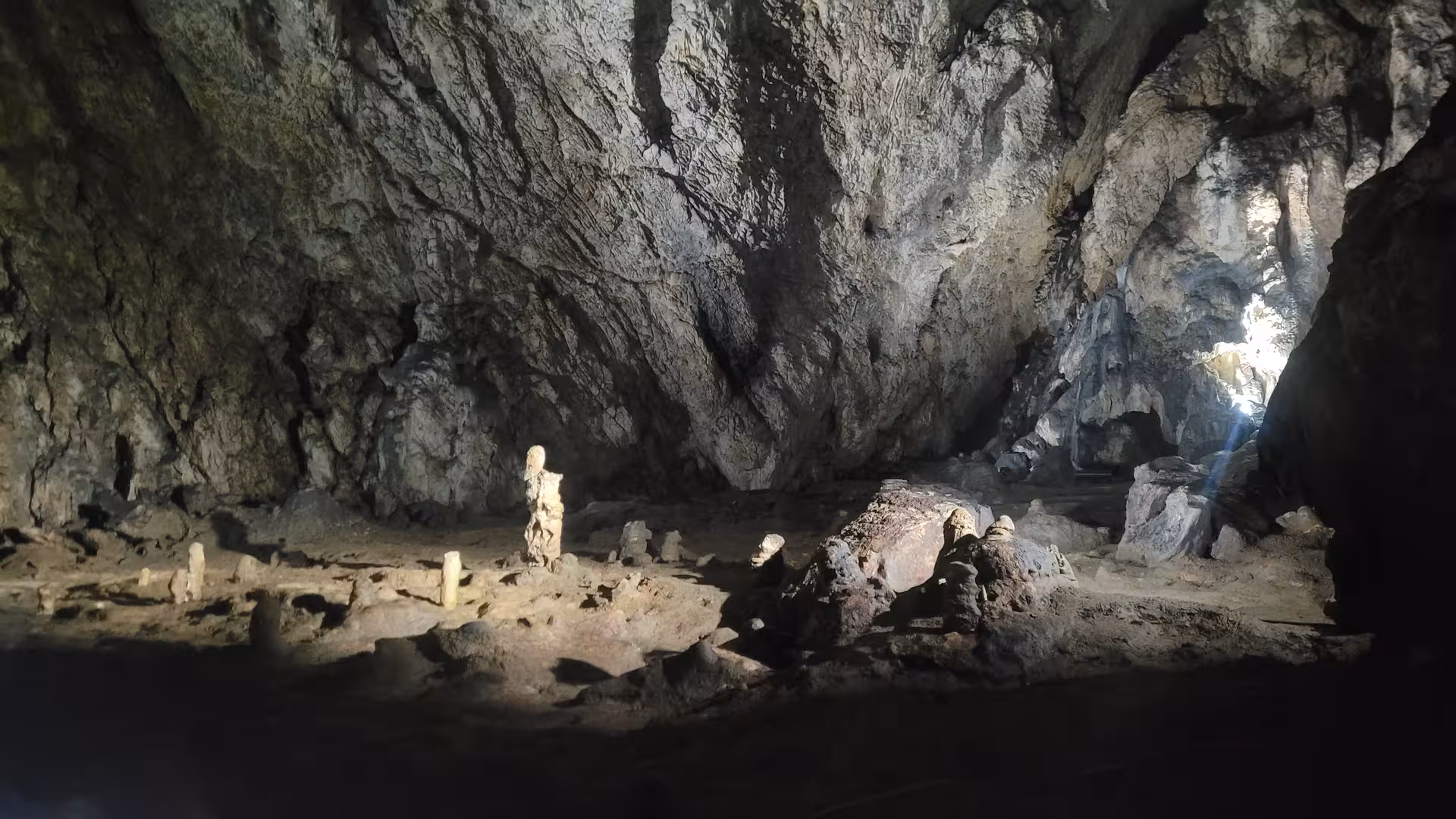 Ancient cave interior with stalagmites and rock formations in Transylvania, Romania