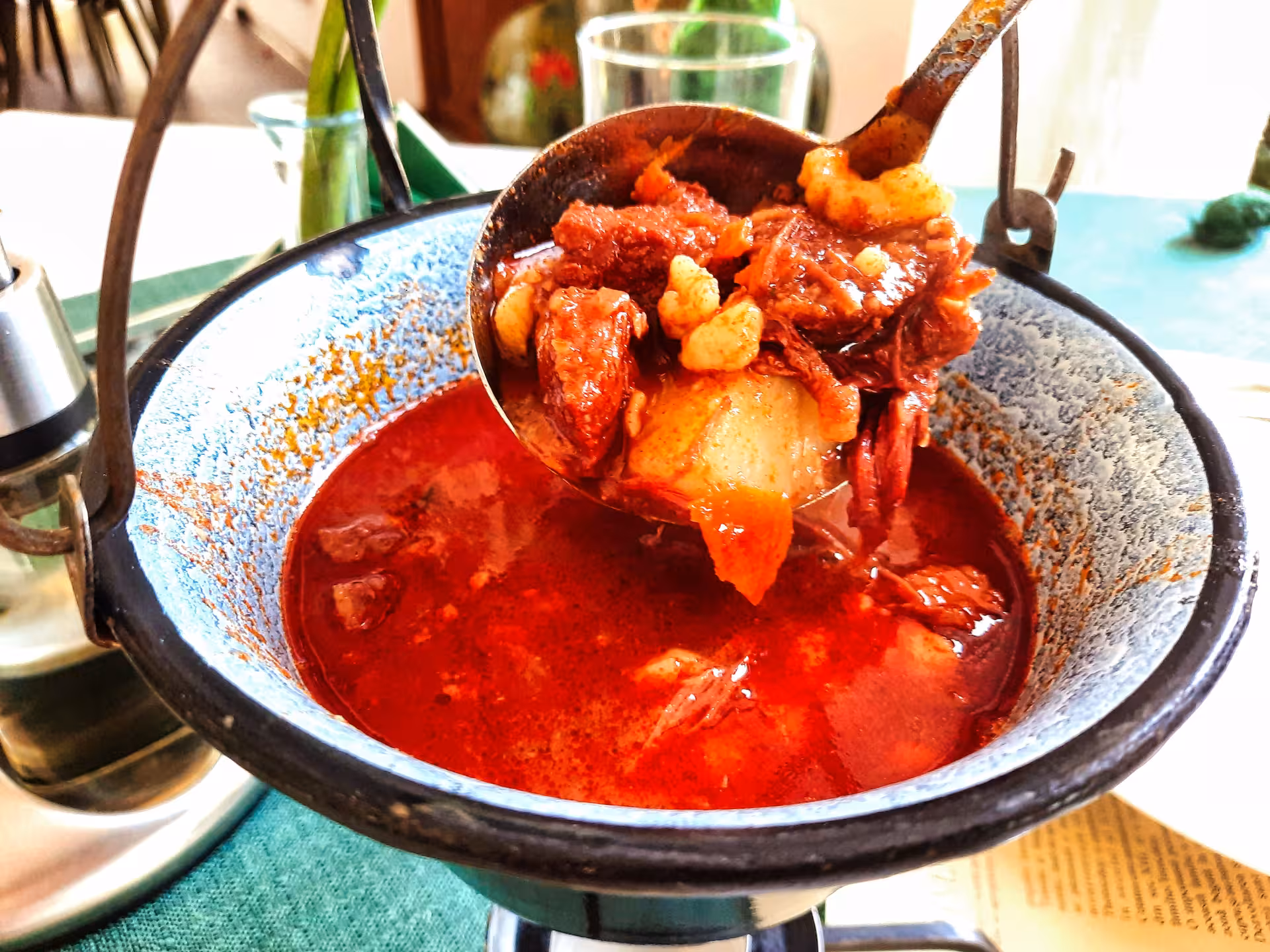 Traditional Transylvanian goulash served in a rustic pot during a guided dinner tour in Rimetea Apuseni Mountains