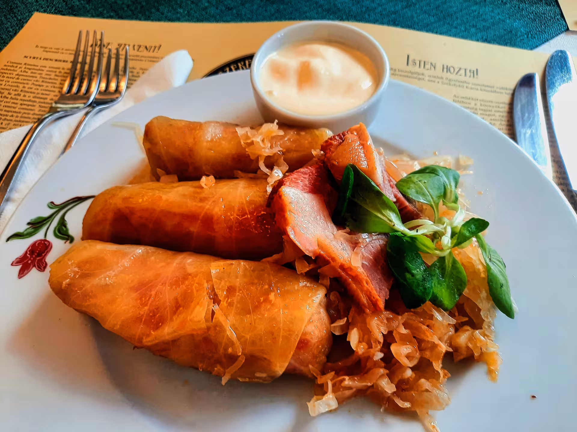 Traditional Transylvanian stuffed cabbage rolls with smoked meat and sauerkraut served on guided Rimetea dinner tour
