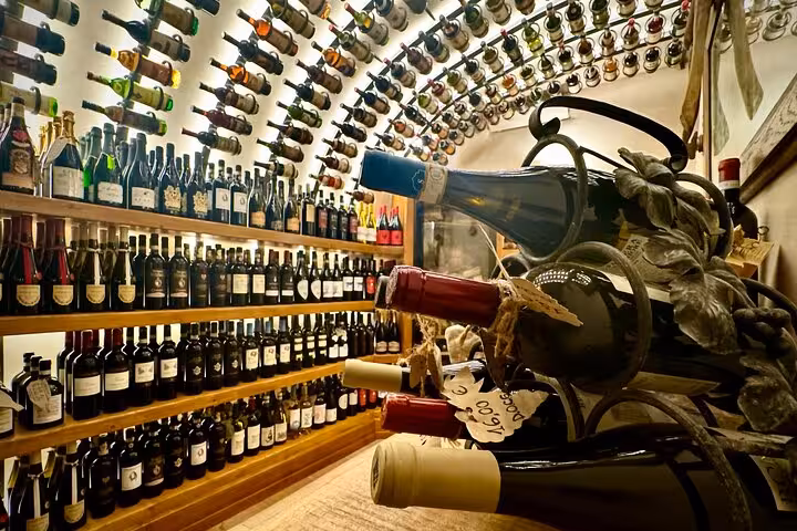 Cozy Trastevere wine cellar in Rome with arched ceiling and shelves packed with Italian red and white wine bottles