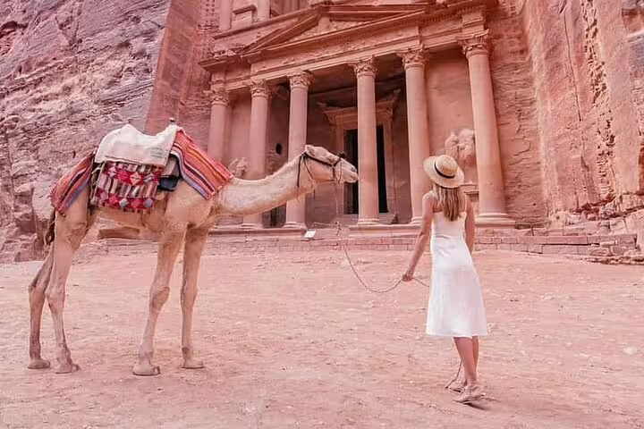 Traveler with camel at Petra Treasury Al-Khazneh, highlight of full-day Jordan tour from Sharm El Sheikh