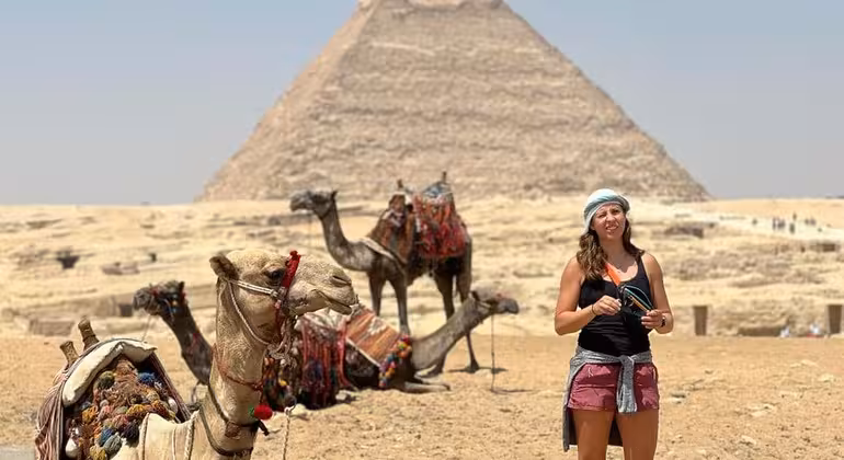 Traveler with camels at the Great Pyramid of Giza, Egypt, on a 3-day private Cairo and Alexandria tour
