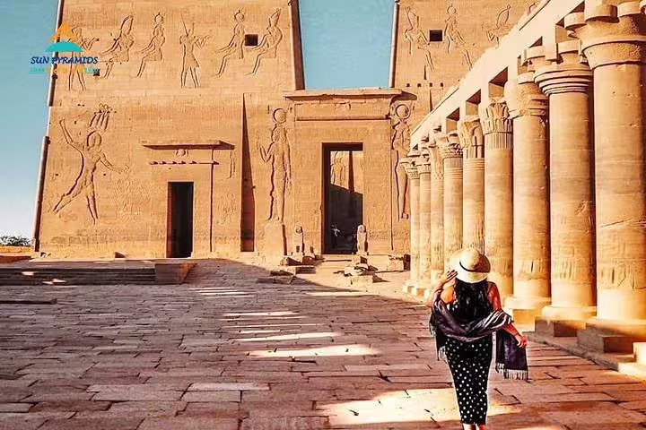 Traveler walking through Edfu Temple courtyard, a highlight of private Luxor day trip from Hurghada by car