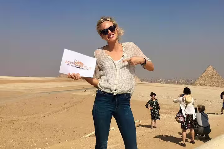 Traveler posing at Giza Plateau on private Alexandria day tour to Giza Pyramids and Egyptian Museum Cairo