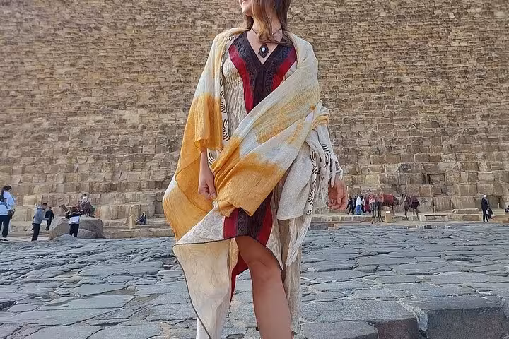 Traveler posing by the Great Pyramid of Giza on a private Cairo tour with Citadel, bazaar and Nile felucca