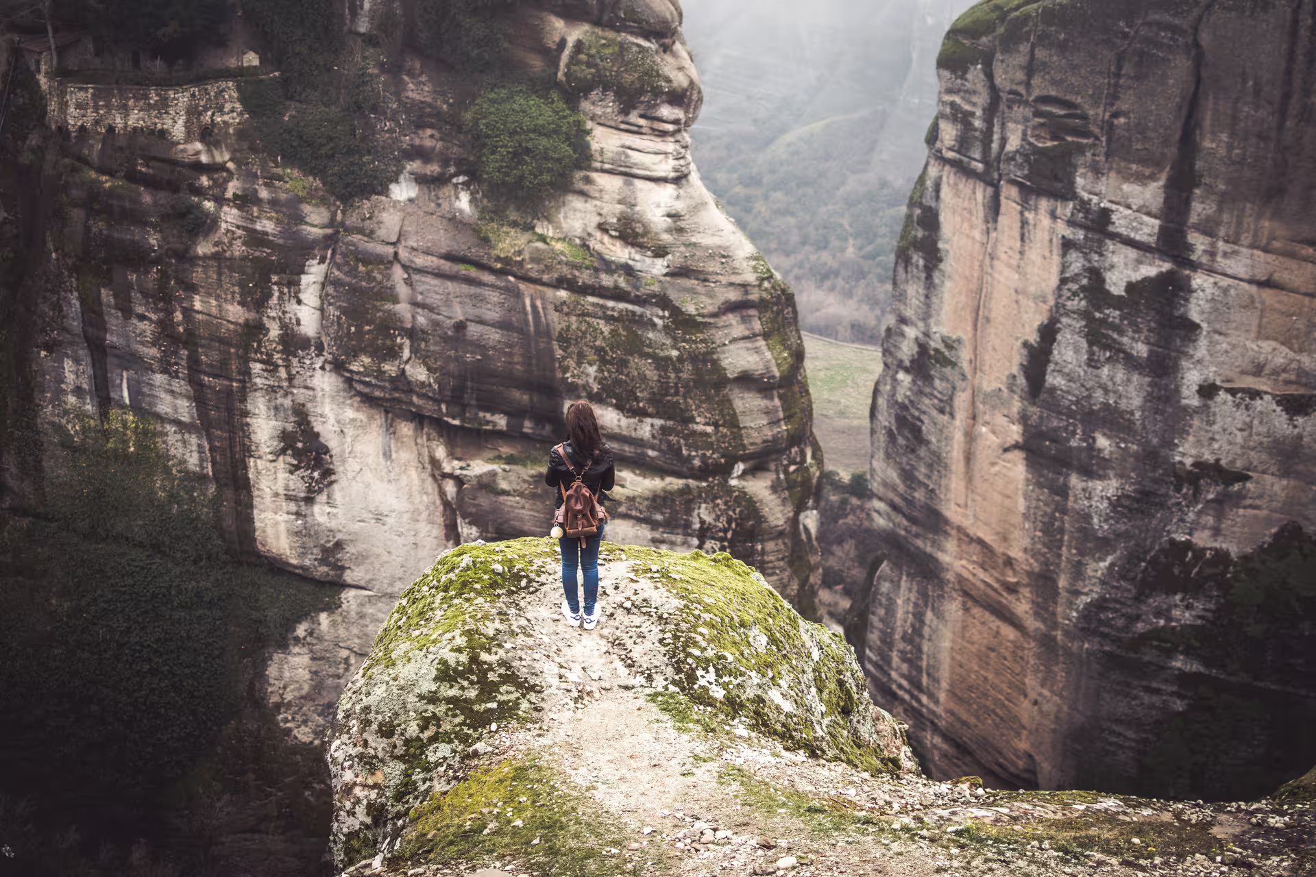 Traveler overlooking Meteora rock formations on private Delphi Meteora Thermopylae tour from Athens with Kalambaka stay
