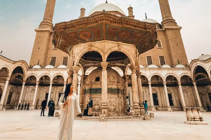 Traveler in Cairo’s Mosque of Muhammad Ali courtyard, cultural stop on Temple of Hatshepsut 5-day trip