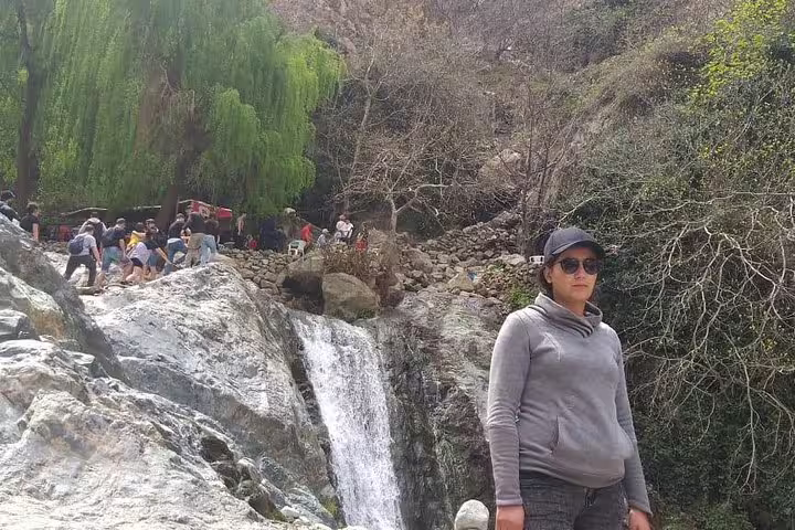 Traveler by Ouzoud Waterfalls cascades on a private day trip from Marrakech to the Atlas Mountains
