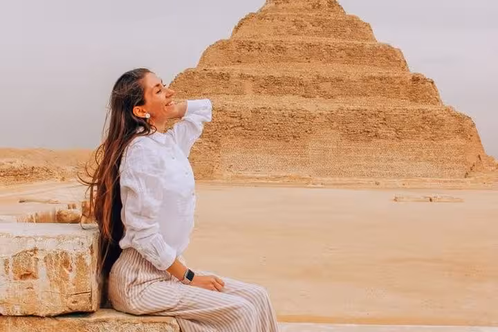 Traveler relaxing by Saqqara Step Pyramid on Giza Pyramids Saqqara Memphis day tour from Cairo