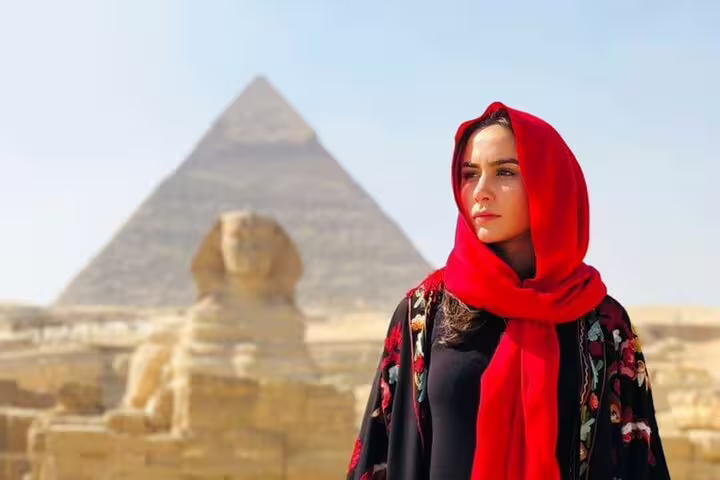 Traveler in red scarf with Sphinx and Great Pyramid, private 2-day Cairo tour to Giza and museums