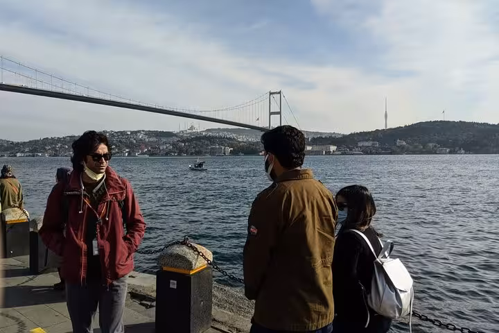 Travelers by the Bosphorus with Istanbul bridge view, part of 7 day 6 night express Turkey tour