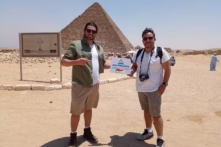 Travelers at the Great Pyramid of Giza on 2-day Cairo and Alexandria tour from Luxor by flight