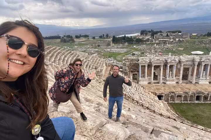 Travelers at Hierapolis amphitheater on a private Pamukkale tour from Kusadasi or Selcuk, Turkey
