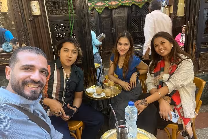 Travelers enjoy tea at Khan El Khalili cafe during a private Giza Pyramids and Egyptian Museum tour in Cairo