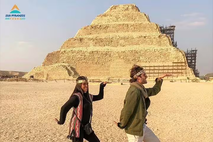 Travelers posing at the Step Pyramid of Djoser in Saqqara, classic Sakkara and Memphis tour photo from Cairo