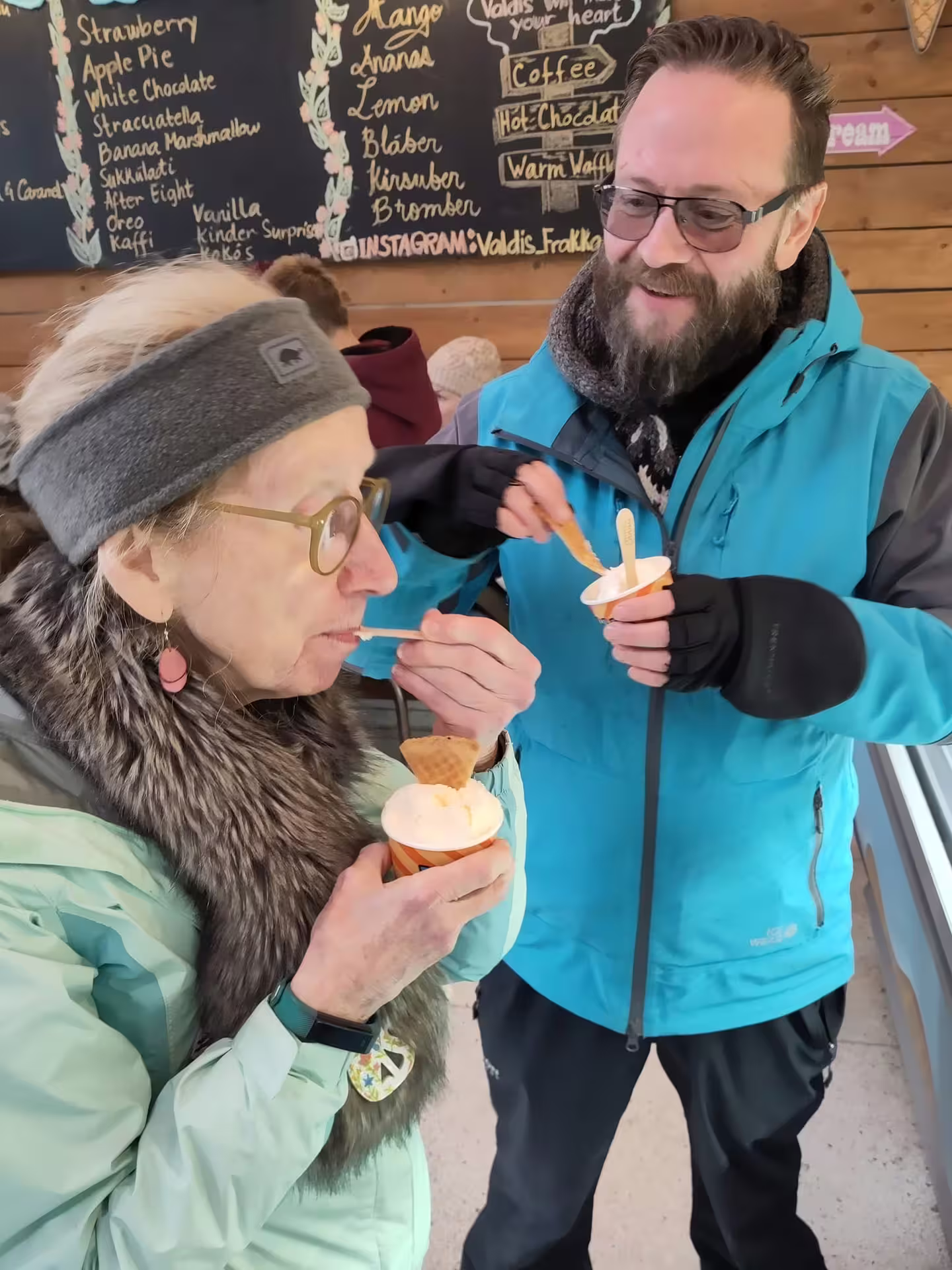 A traveller enjoying a cup of Ice Cream. 