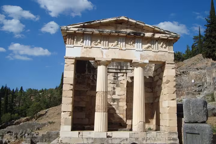 Treasury of the Athenians at Delphi, iconic ancient Greek temple on Mystical Delphi luxury day tour