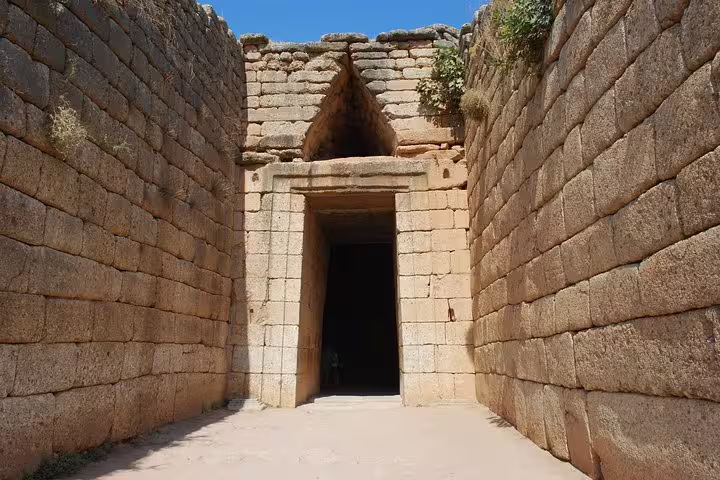 Close-up of the Treasury of Atreus beehive tomb doorway in Mycenae on small-group tour from Athens