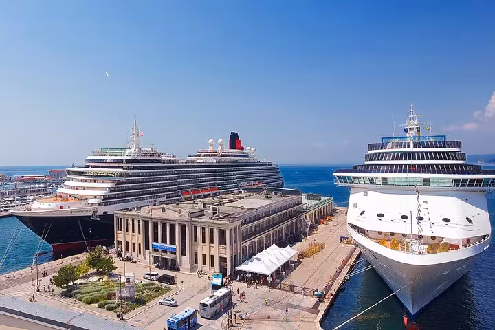 Cruise ships docked at Trieste terminal, starting point for scenic transfer service to Venice, Italy's iconic city.