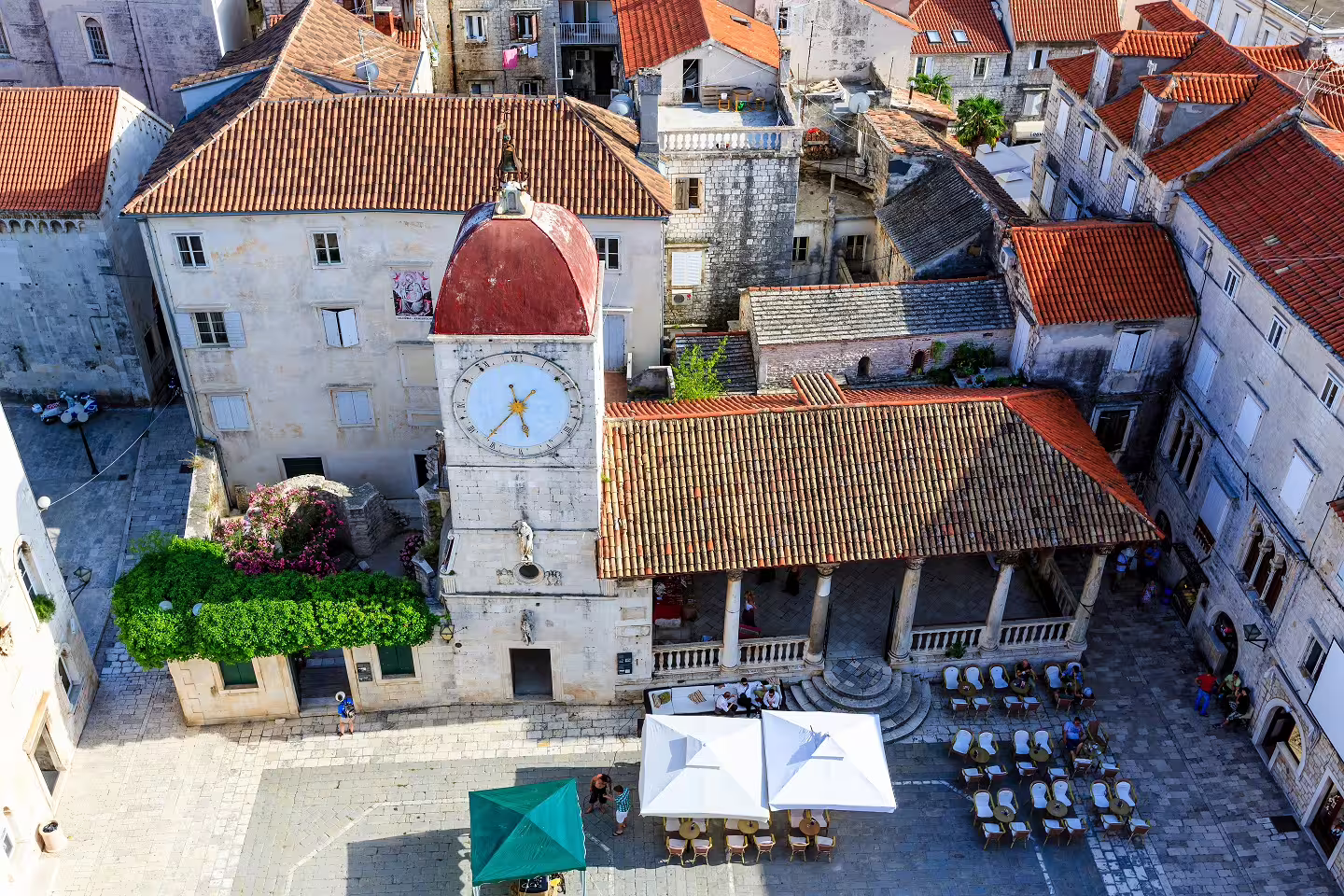 Aerial view of Trogir Old Town clock tower and waterfront square, highlight of Croatia island hopping 15 days