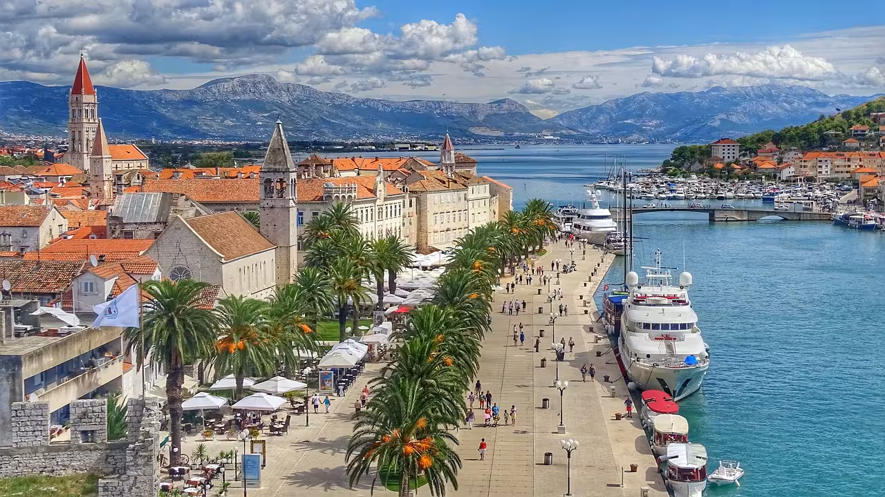 Panoramic Trogir Old Town promenade and marina with palm trees, ideal stop on the Klis Fortress guided tour