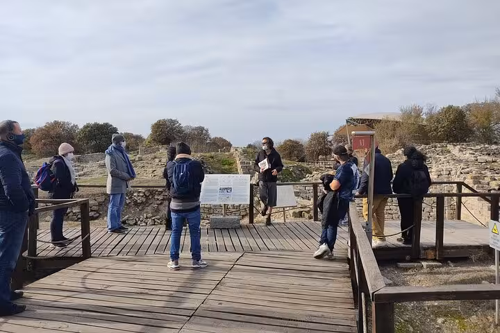 Guided group briefing at ancient Troy ruins on full-day Troy tour from Istanbul with lunch included