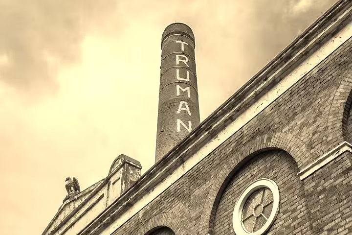 Truman Brewery chimney stack in London's East End, historic brick building on Jack the Ripper walking tour route