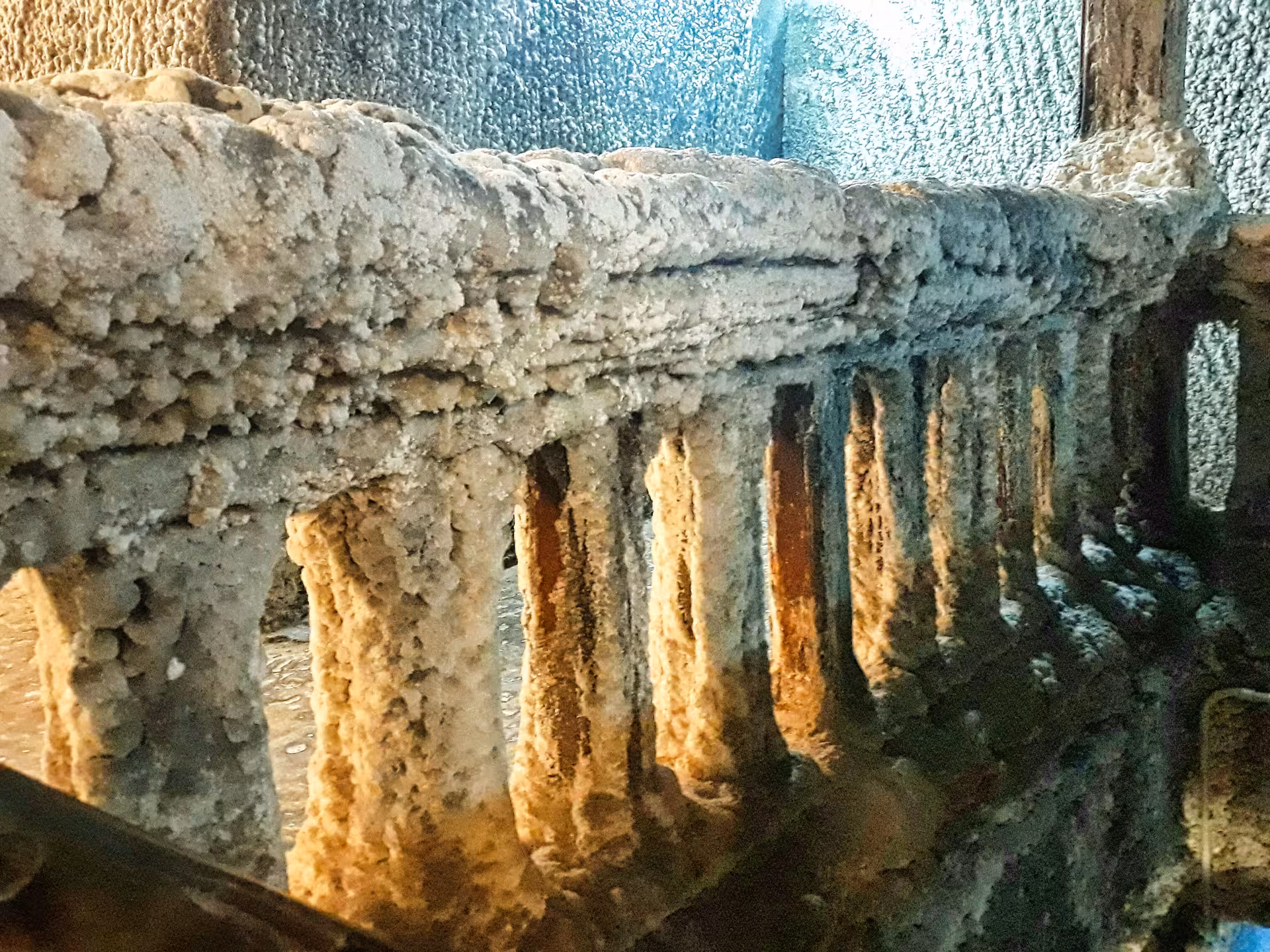 Close-up of natural salt crystal formations and stalactites inside the historic Turda Salt Mine Romania