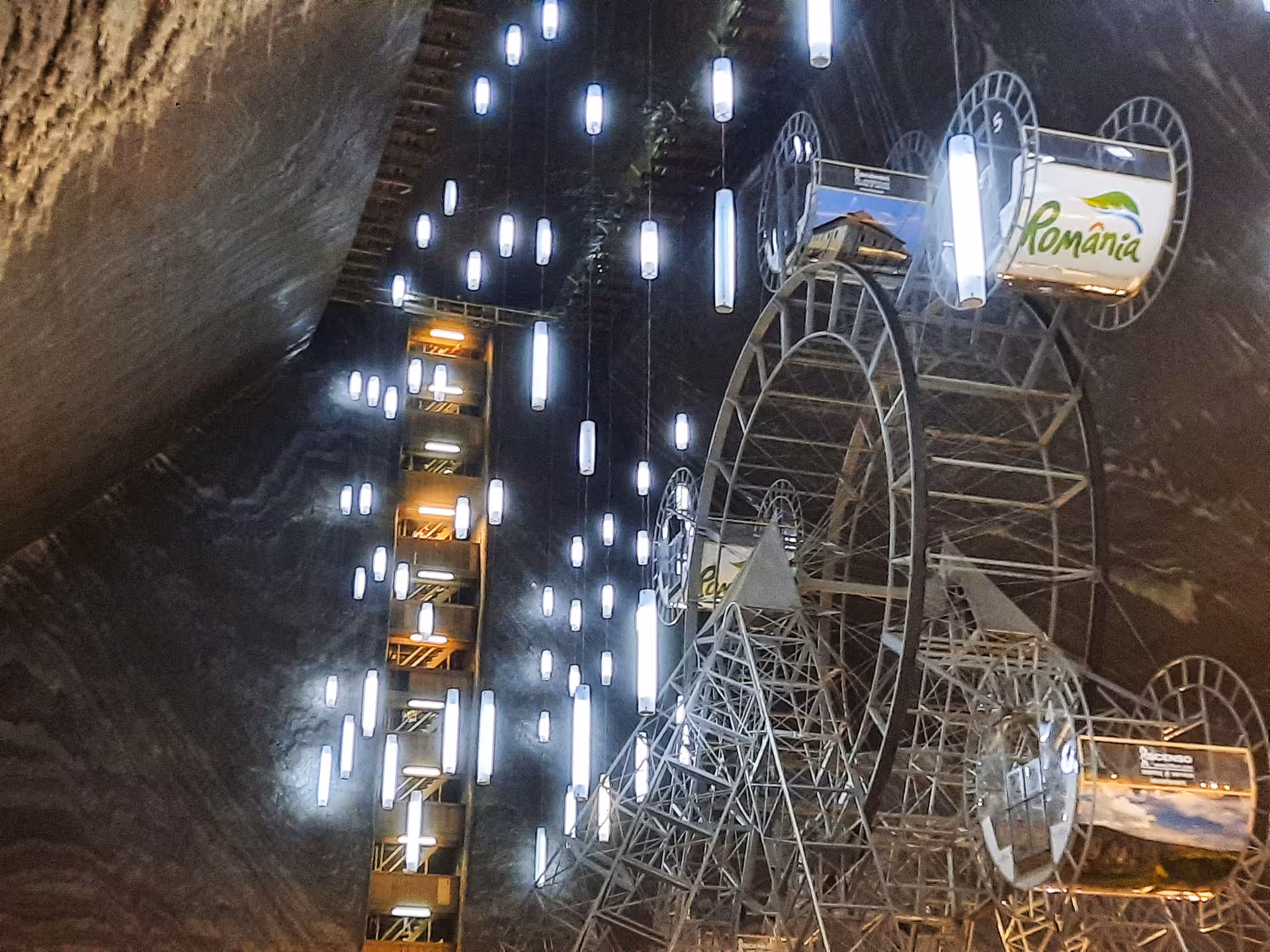 Turda Salt Mine underground Ferris wheel and illuminated attractions inside the historic Romanian salt cavern on a guided day tour