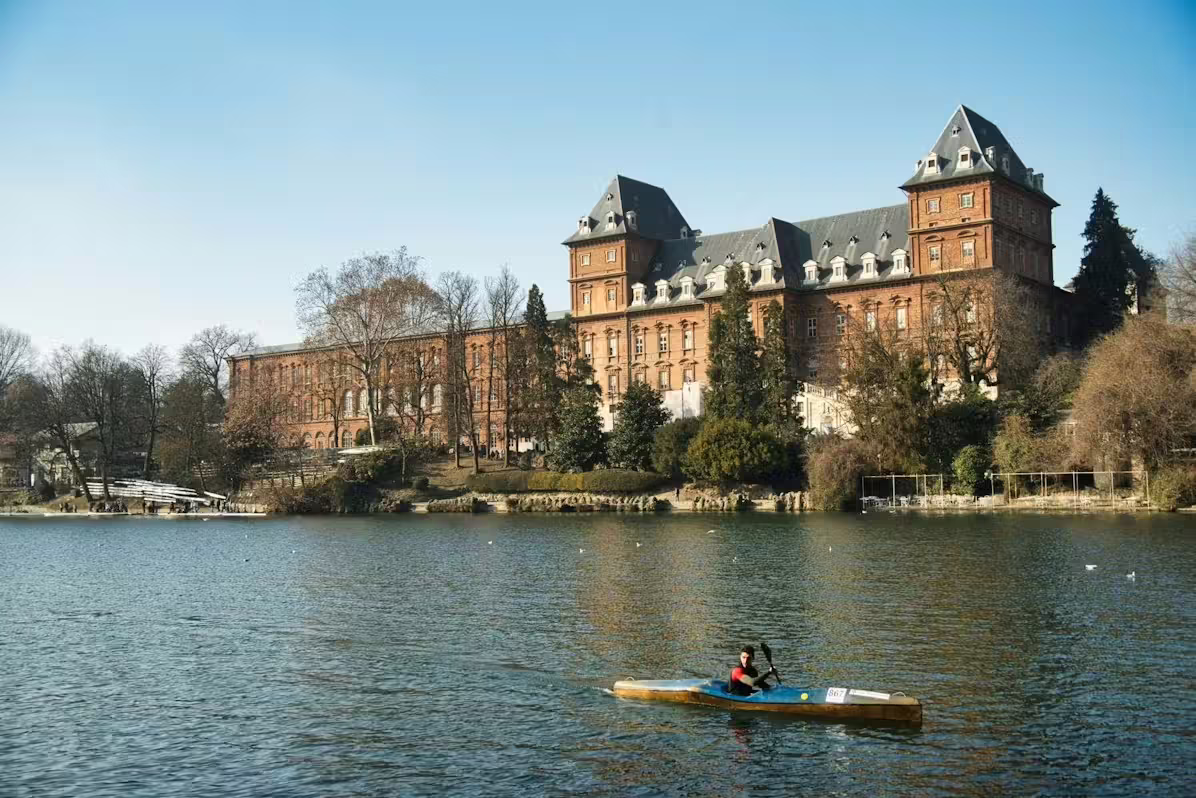View of Turin’s historic Castello del Valentino by the Po River, visited on a private city sightseeing tour in Italy