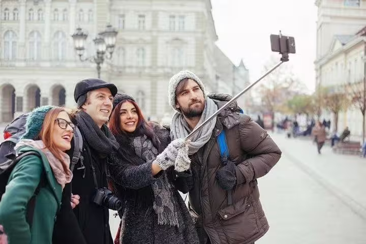 Happy friends taking a selfie in Turin historic center during a private, personalized top sights walking tour