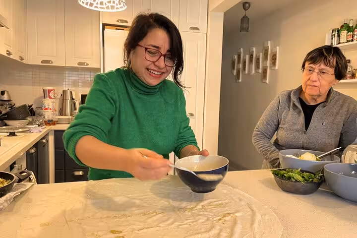 Local host teaches Turkish dough prep in Istanbul city center home kitchen cooking class experience