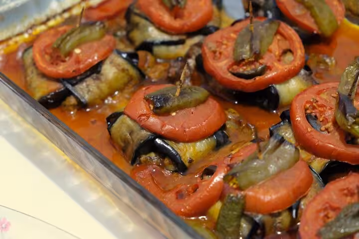 Homemade Turkish eggplant rolls in tomato sauce, prepared in a private Turkish cuisine cooking class with local moms