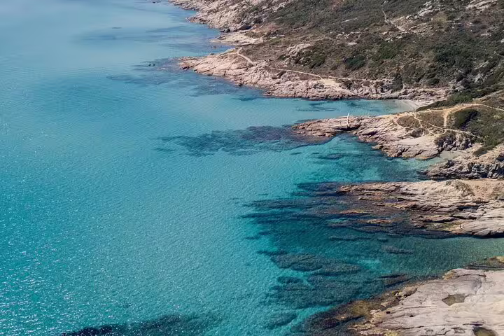 Crystal clear turquoise waters along rocky coastline near Saint Tropez French Riviera