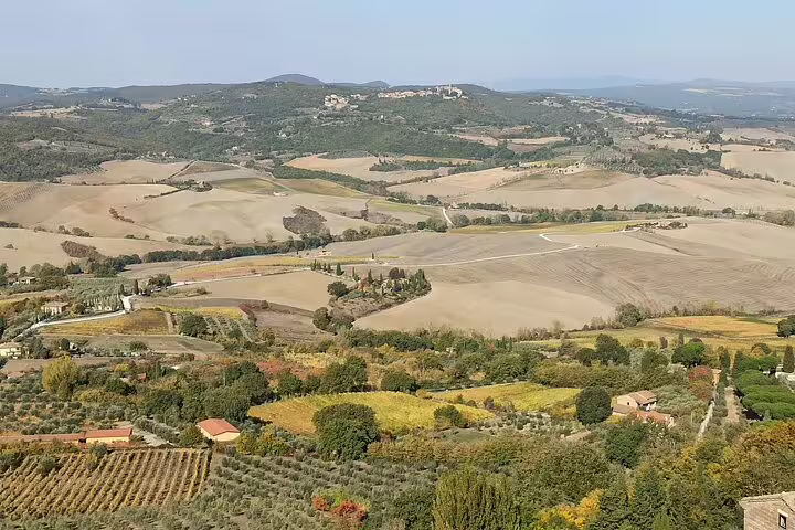 Rolling Tuscan hills and vineyards near Montalcino on a Siena, Chianti and Brunello wine tasting tour in Tuscany, Italy