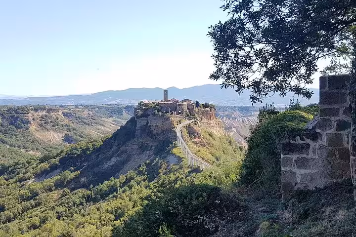 Clifftop medieval hill town in Tuscany with dramatic valley views, scenic stop on 8-day private village tour