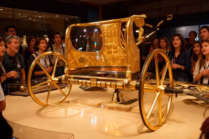 Tutankhamun’s gilded chariot on display at the Grand Egyptian Museum in Cairo, optional add-on after Giza tour