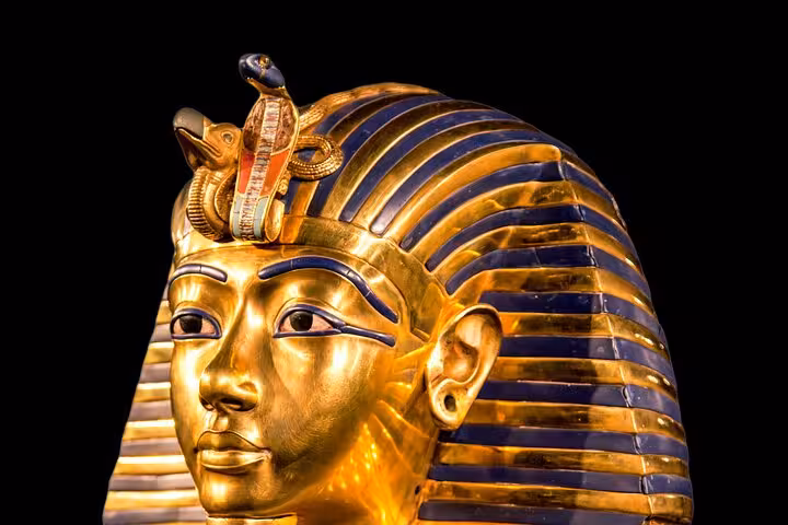 Tutankhamun golden funerary mask close-up, iconic artifact seen on Cairo Grand Egyptian Museum tour from Sharm