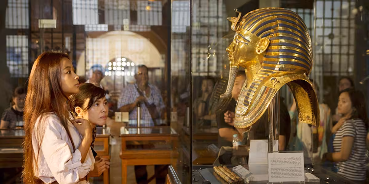 Visitors viewing Tutankhamun golden mask at the Egyptian Museum Cairo on a private guided tour