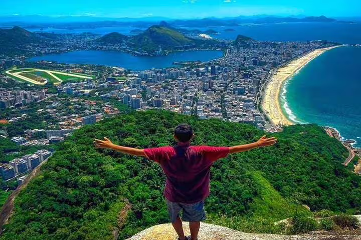 Panoramic view from Two Brothers Hill overlooking Rio's coastline and cityscape, perfect for hiking enthusiasts.