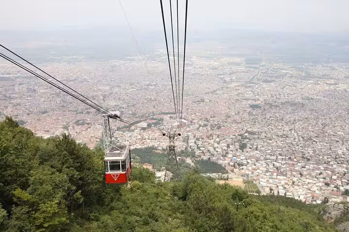 Uludag cable car descending over Bursa city view, popular Istanbul day trip with lunch and gondola option