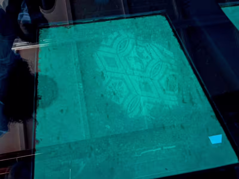 Underwater Roman mosaic at Baia Sommersa seen through glass-bottom boat on Archeoemotions tour