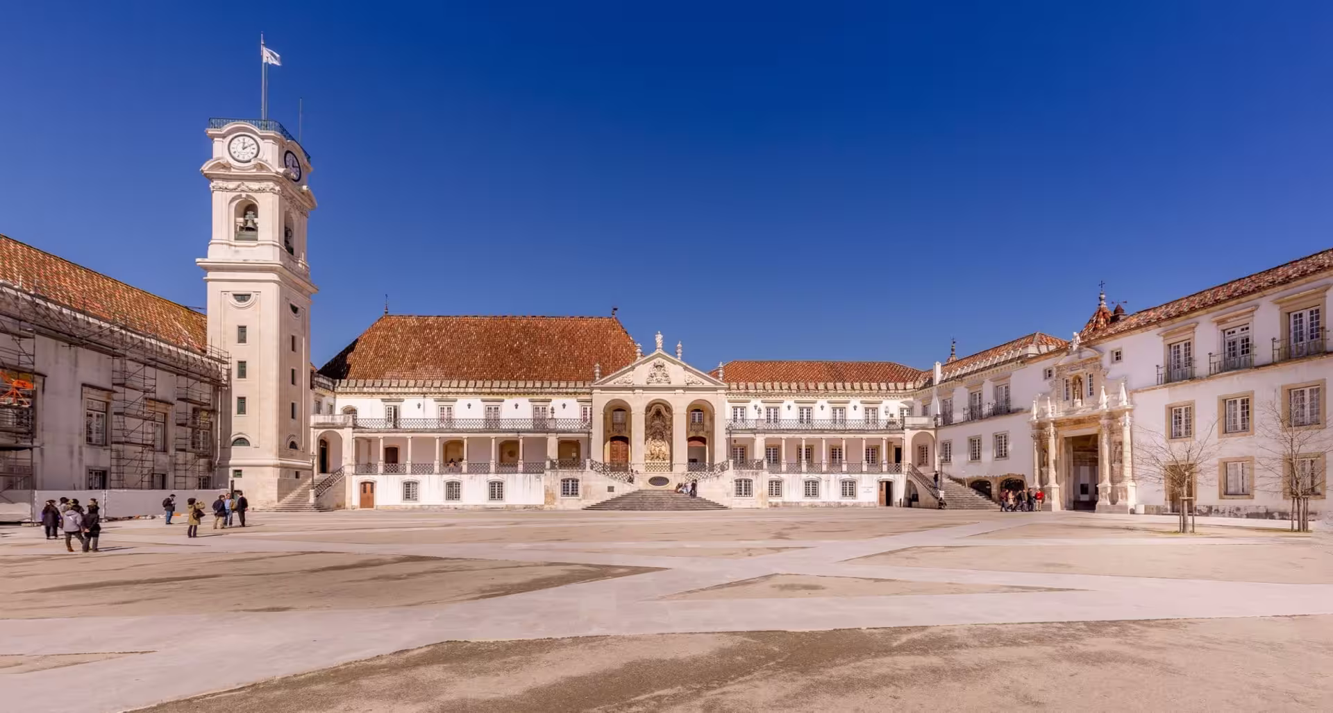 Historic University of Coimbra courtyard under clear blue skies, featured in the Coimbra & Aveiro Private Full-Day XL Tour.