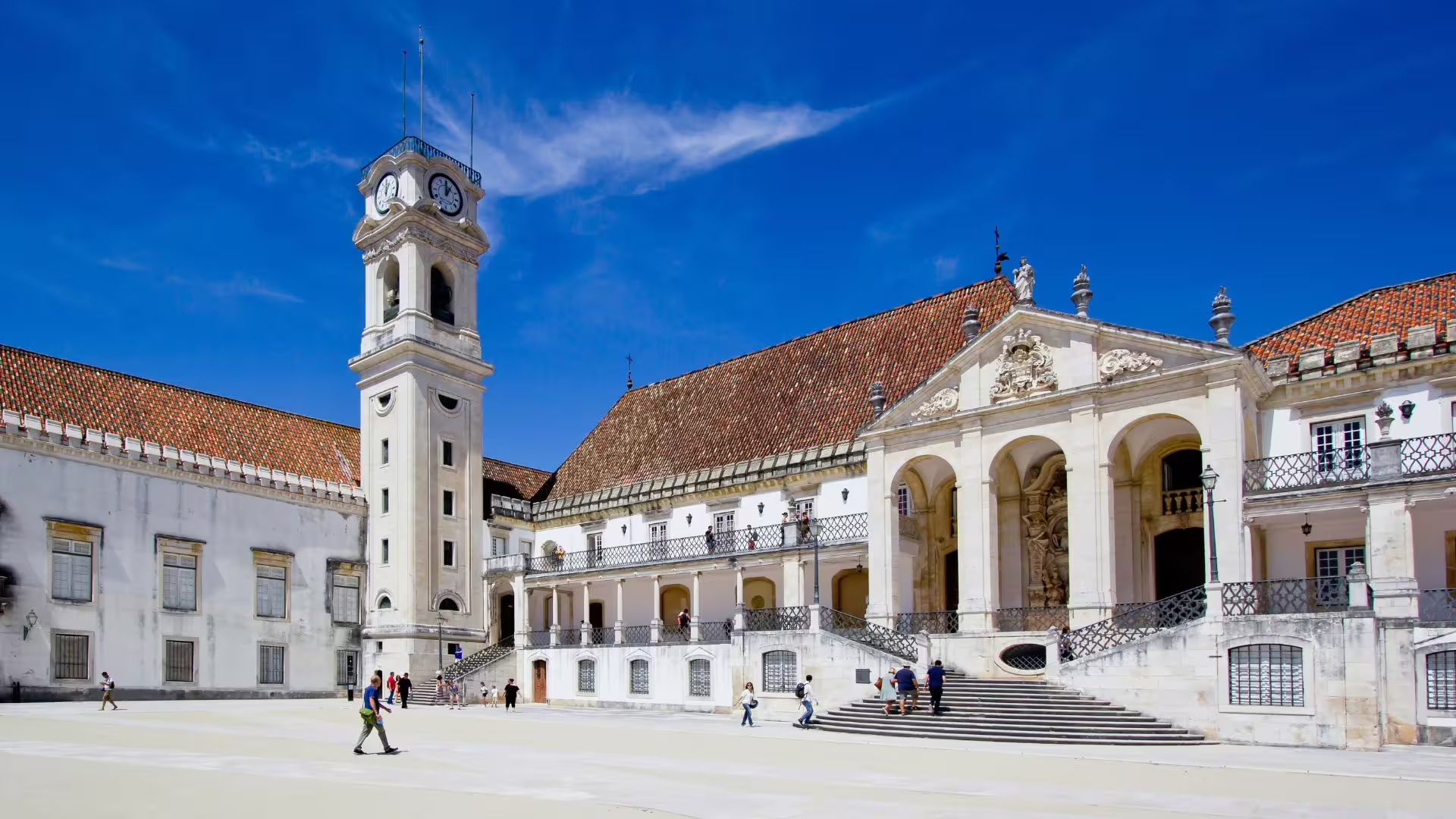Explore the historic University of Coimbra courtyard, a key highlight of the Private Aveiro & Coimbra Tour in Portugal.