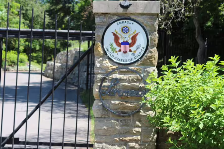 US Embassy gate with Great Seal on stone pillar in Rockcliffe Park Ottawa