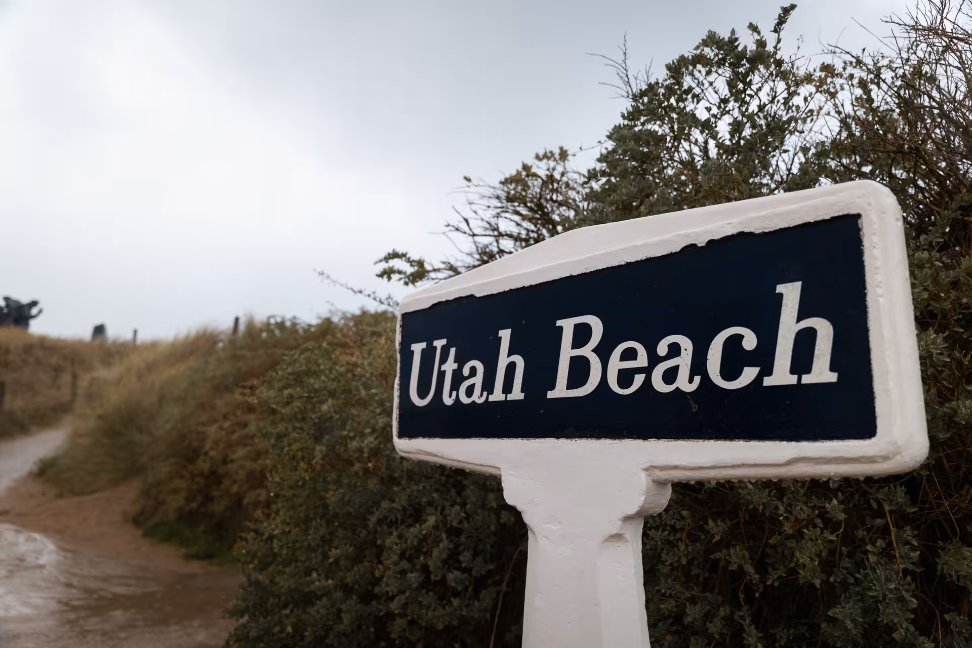 Utah Beach sign along a path in Normandy, France, on a cloudy day