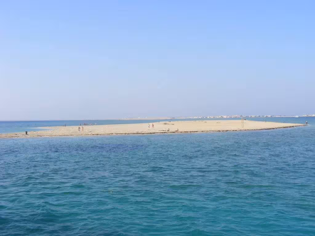 Utopia Island sandy sandbar surrounded by turquoise Red Sea waters with visitors on the beach, Hurghada