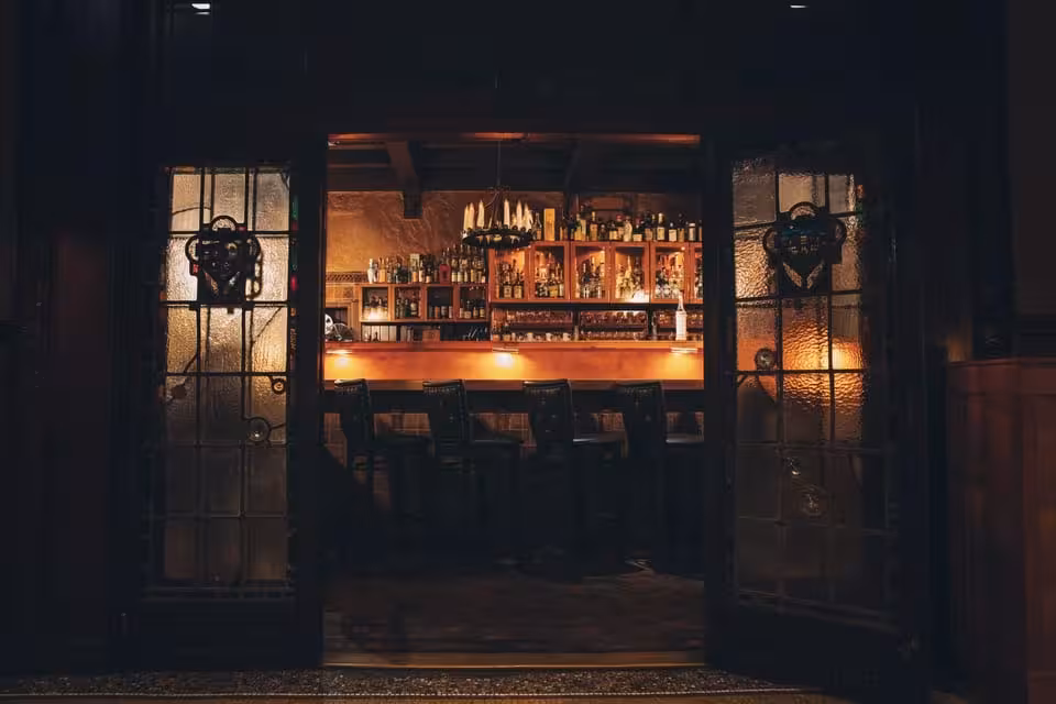 Warmly lit hidden speakeasy bar entrance in Utrecht featured on Ludwig’s Hidden Speakeasy VIP tour